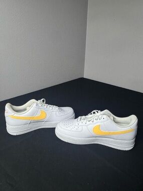 Nike White Low-Top Sneakers with Yellow Swoosh